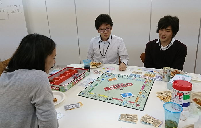 e-Jan employees enjoying a game of Monopoly